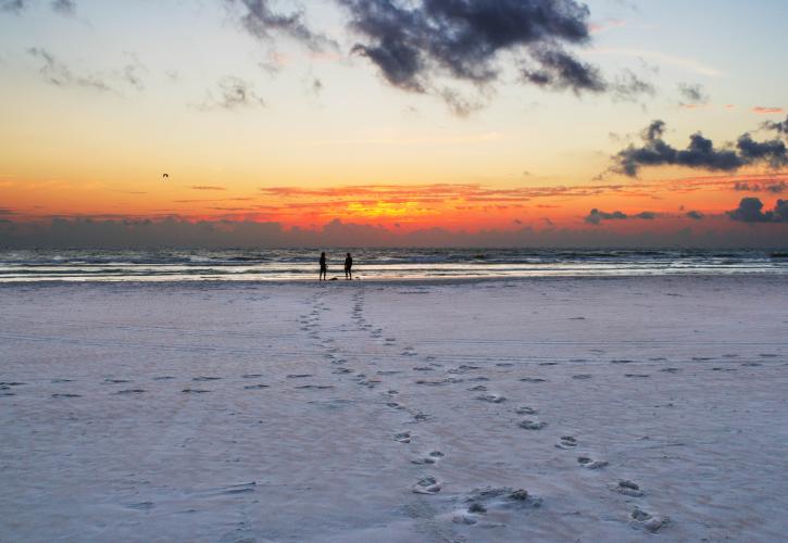 A view of the sunset over the beach.